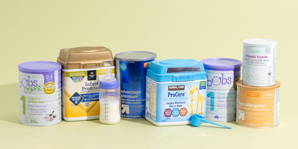 Containers of our favorite powdered infant formula, arranged in a row.